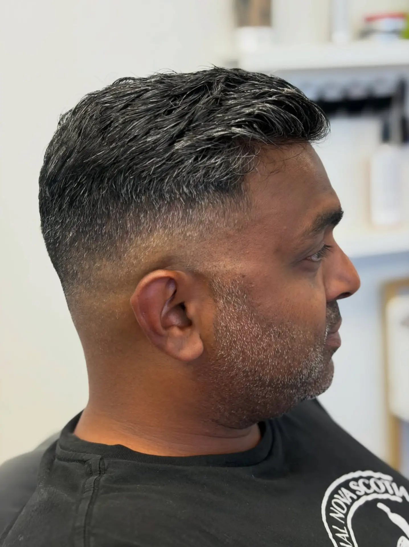Skin fade with textured top, finished at The Bedford Barber
